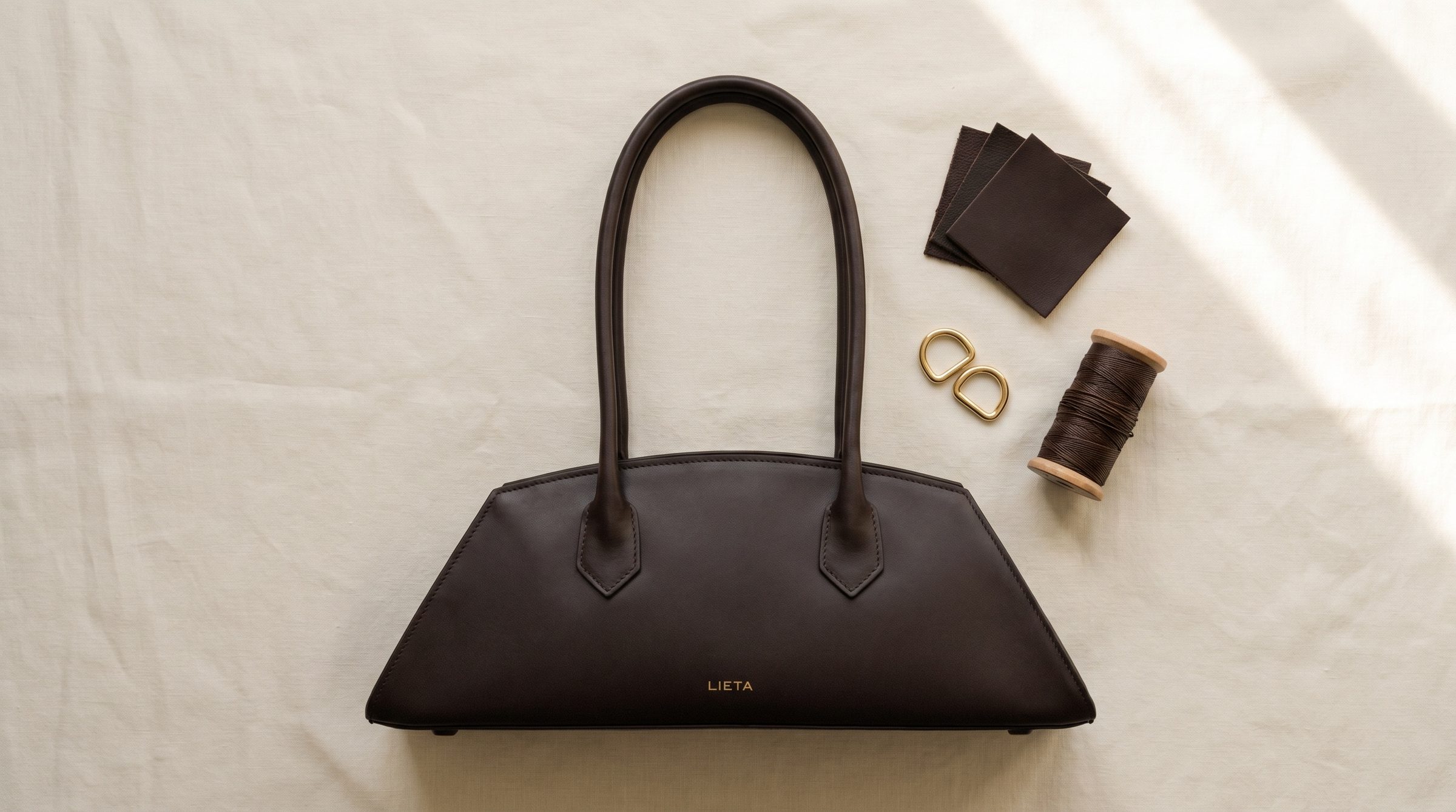 The Lungo in chocolate Italian calf leather on a near-white studio background.